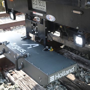 Argus Track Geometry Measurement system on the hitch of a pickup truck on railroad track.